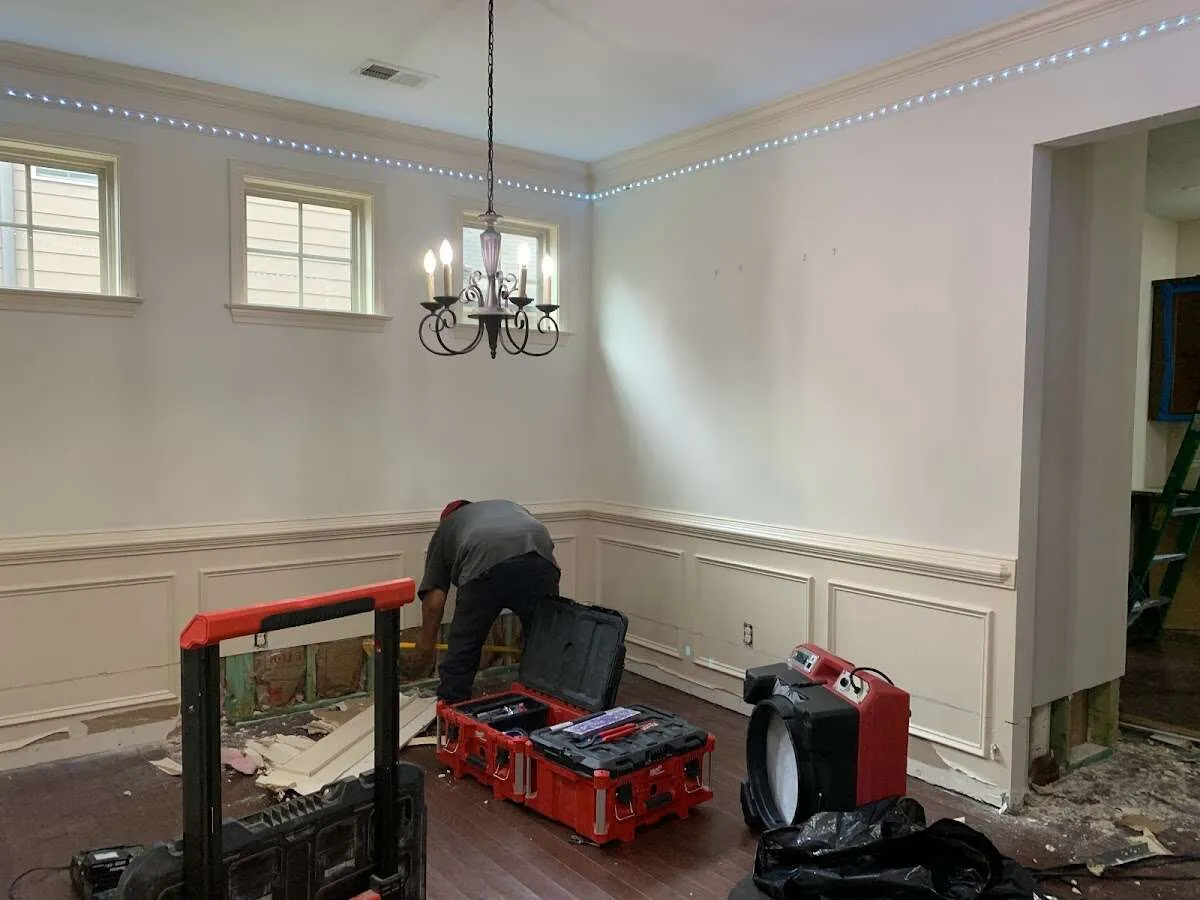 Restoration technician with professional equipment in Country Club